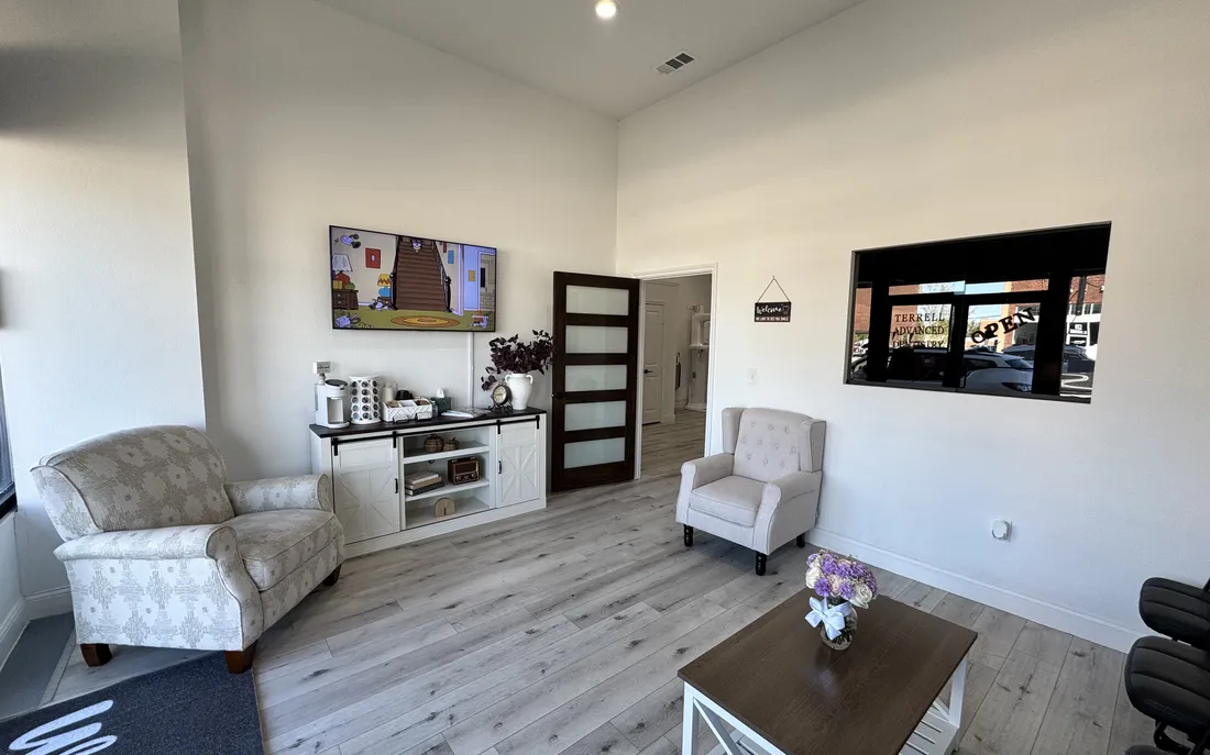 The waiting room at Terrell Advanced Dentistry — armchairs, coffee station, and natural light